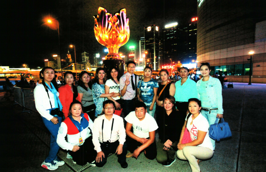 Frank the tour guide with Mongolian group at the Golden Bauhinia Plaza