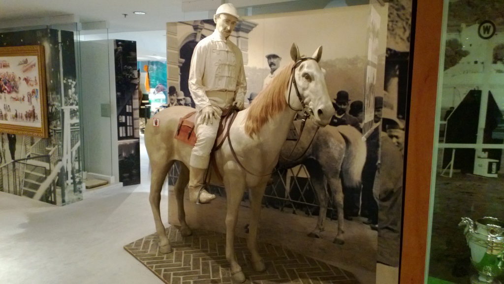 white wax figure jockey pony