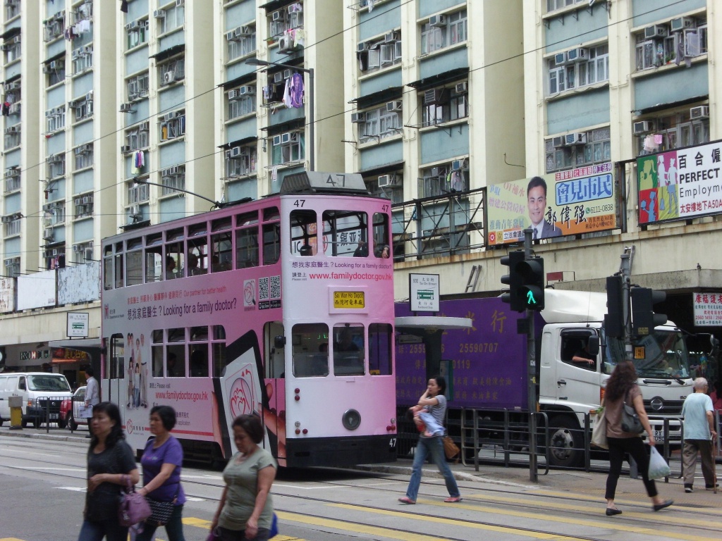 tram people buildings lorry traffic lights