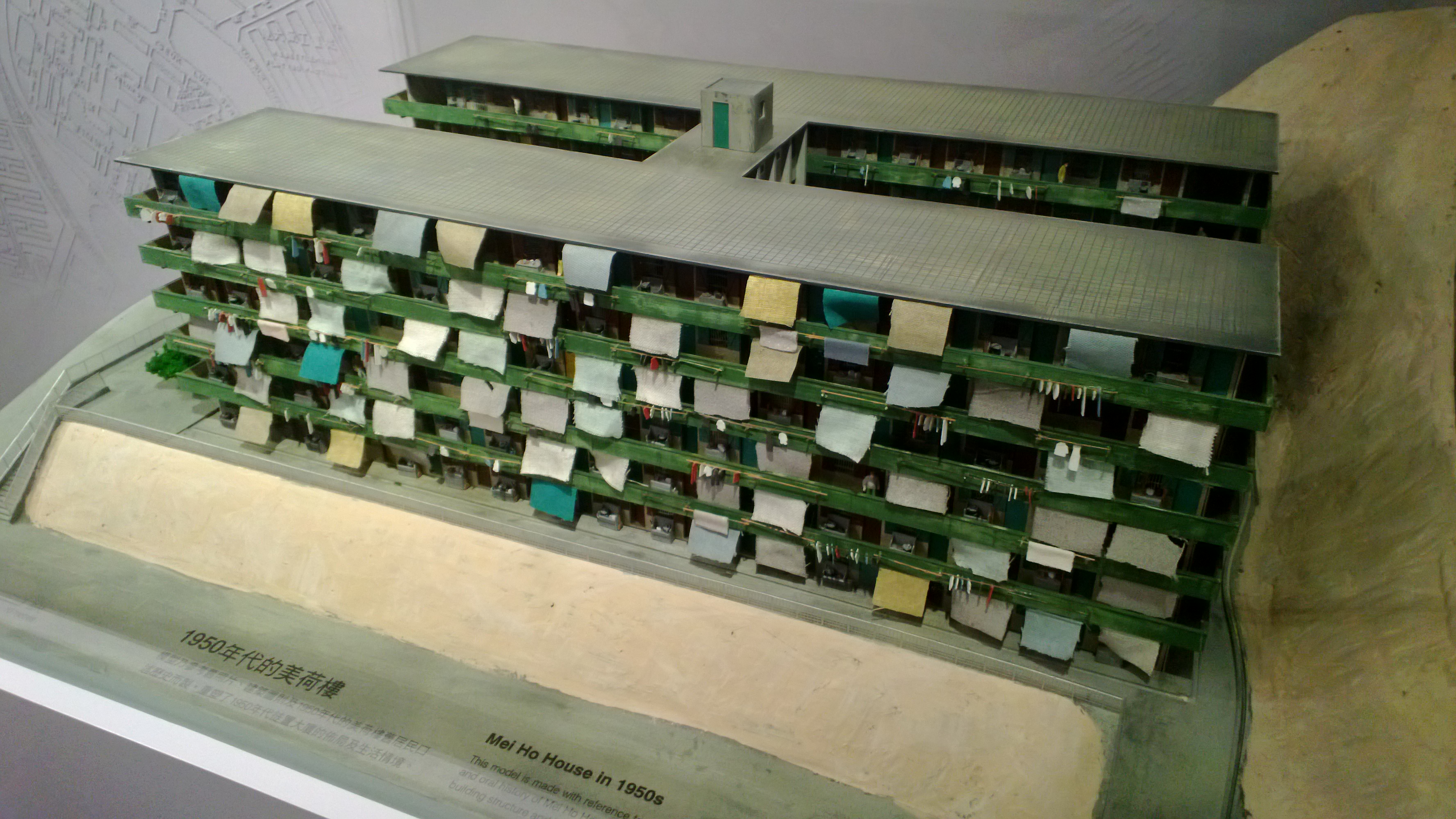 Model shows visitors the original Mei Ho House in the past