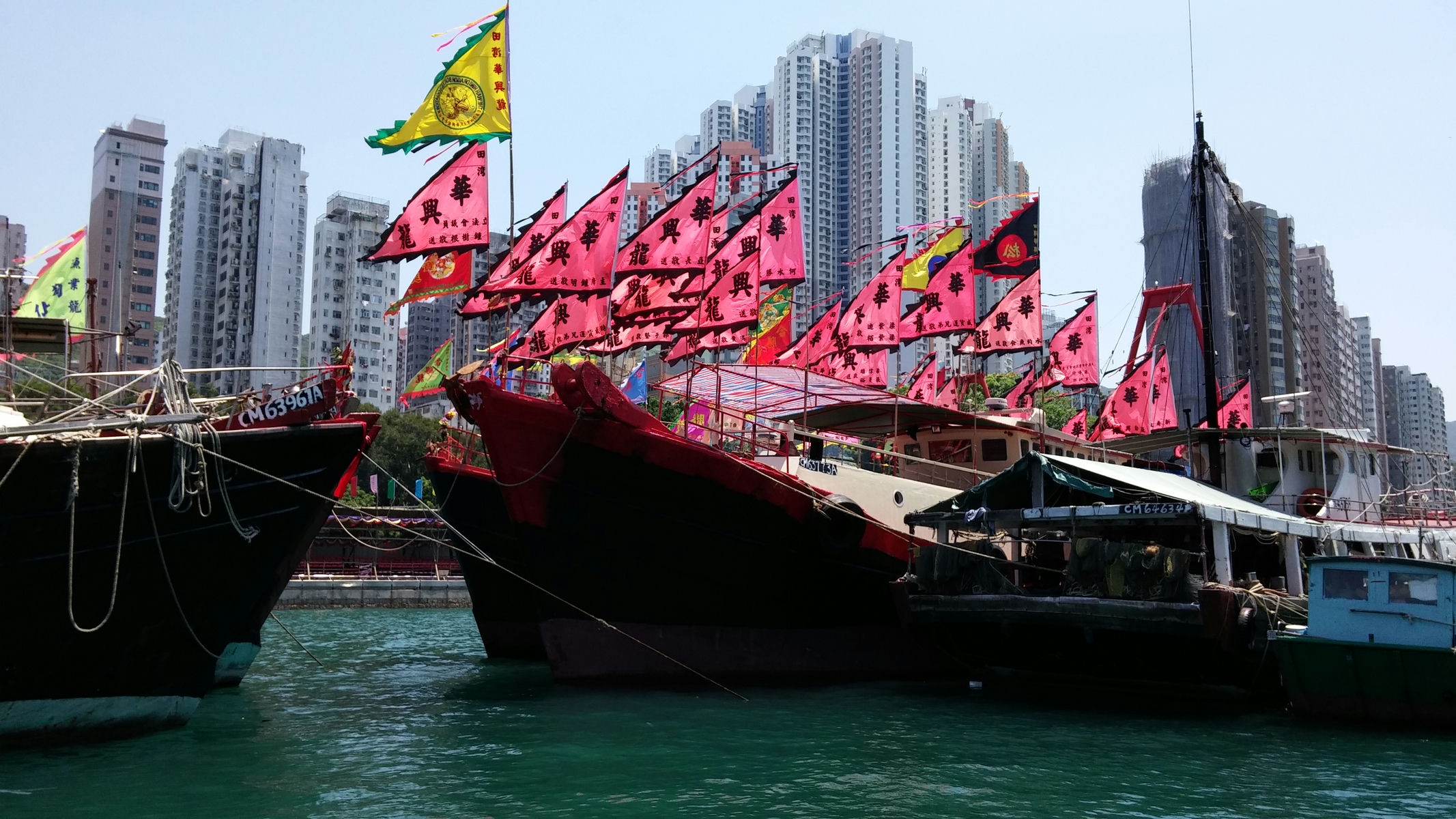 Aberdeen fishing boats with flags for celebrating Dragon Festival