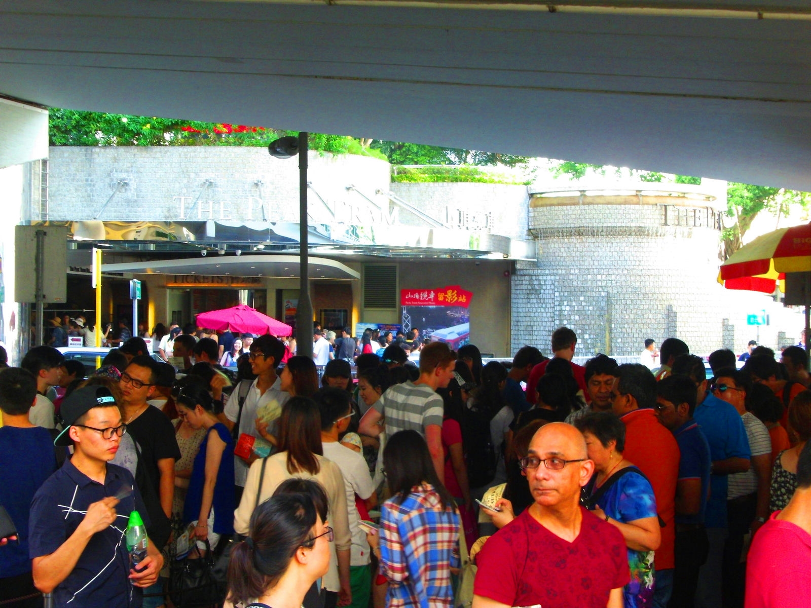 The long queue on the opposite side of the Peak Tram ticket office in the afternoon