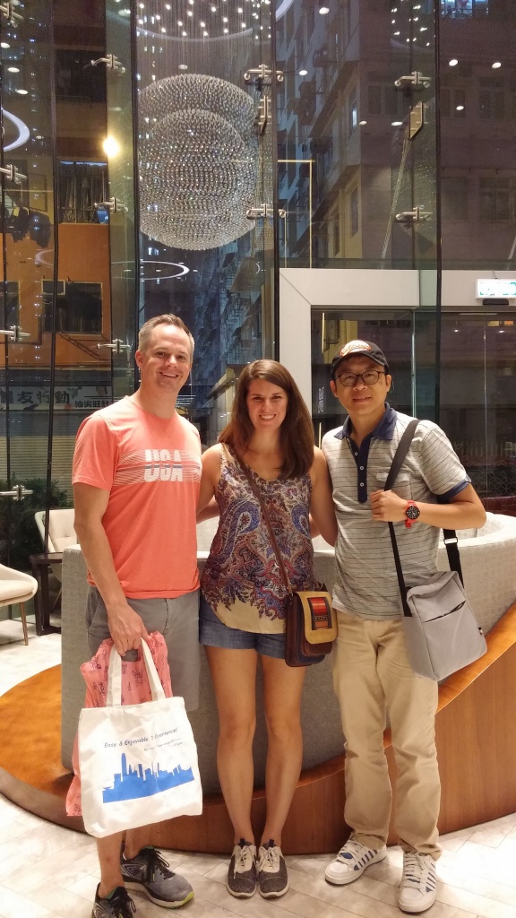 three people takes photos at hotel lobby