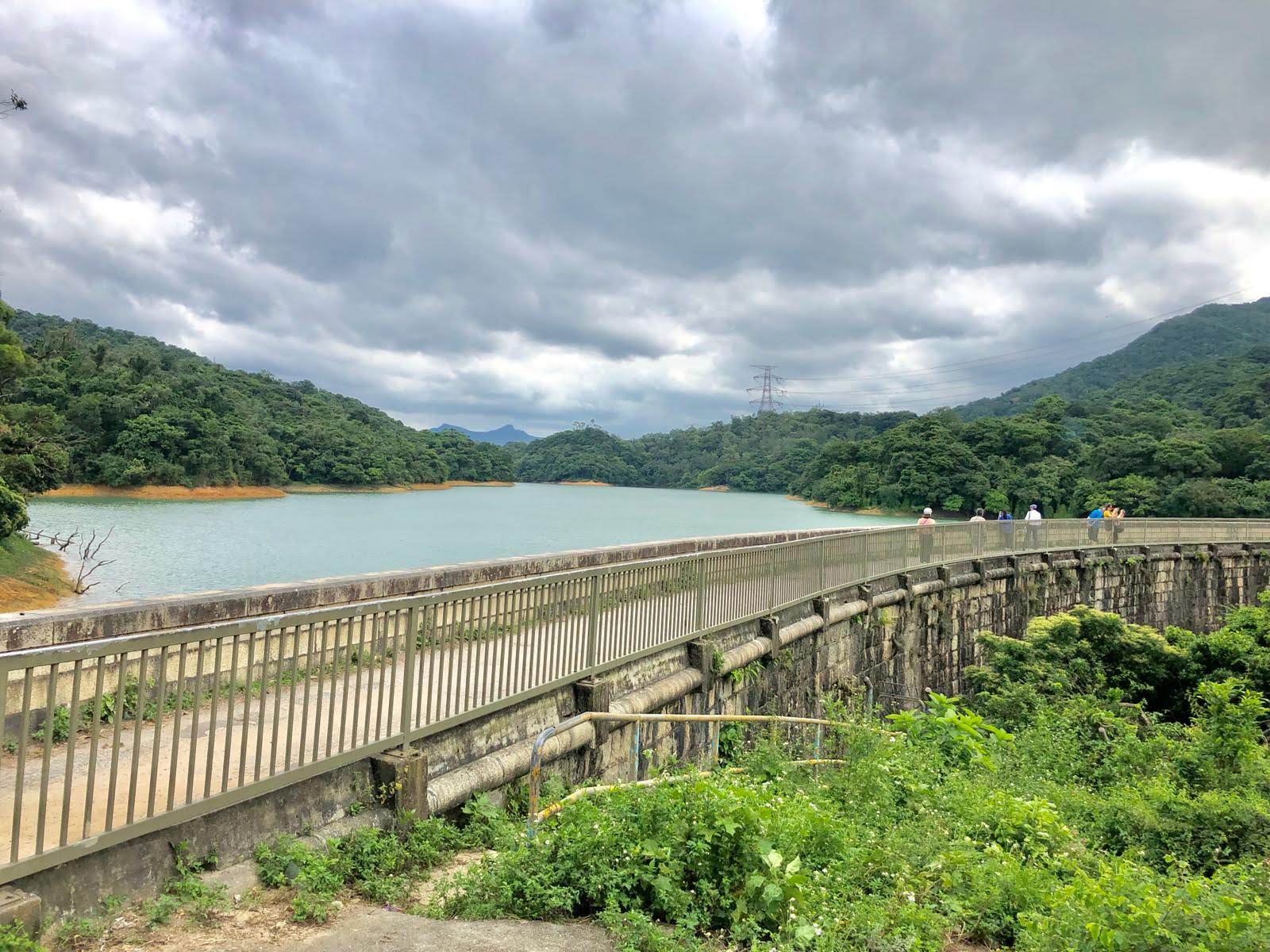 cloudy sky, green hill, water, dam