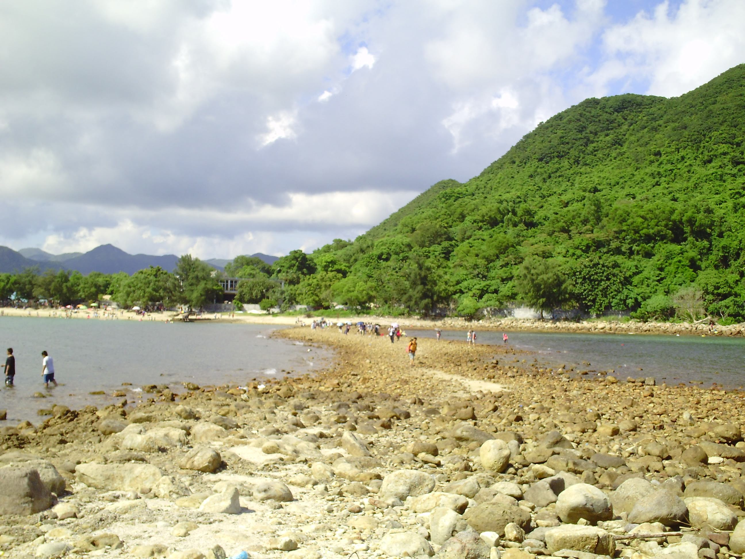 Cloudy sky, green hlll, Tombolo, beach, sea water