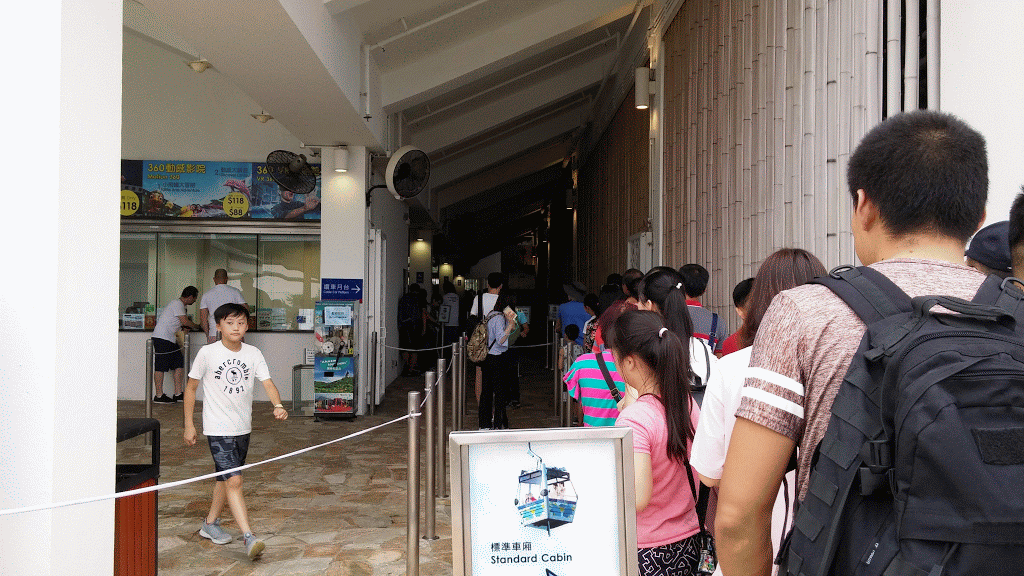 People wait for the cable car at Ngong Ping.