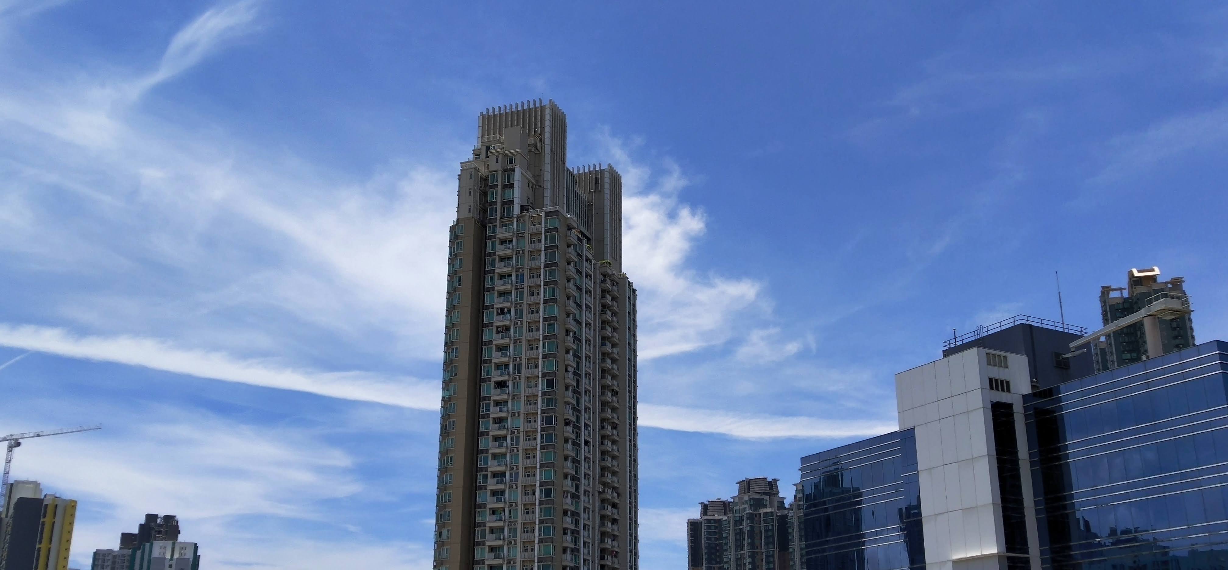 blue sky, cloud, contrail, tall buldings