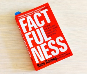Orange book cover, book name Factfulness, author Hans Rosling