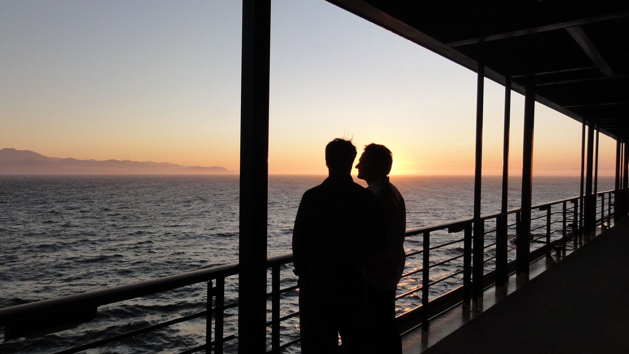 two people, sunset, ship deck