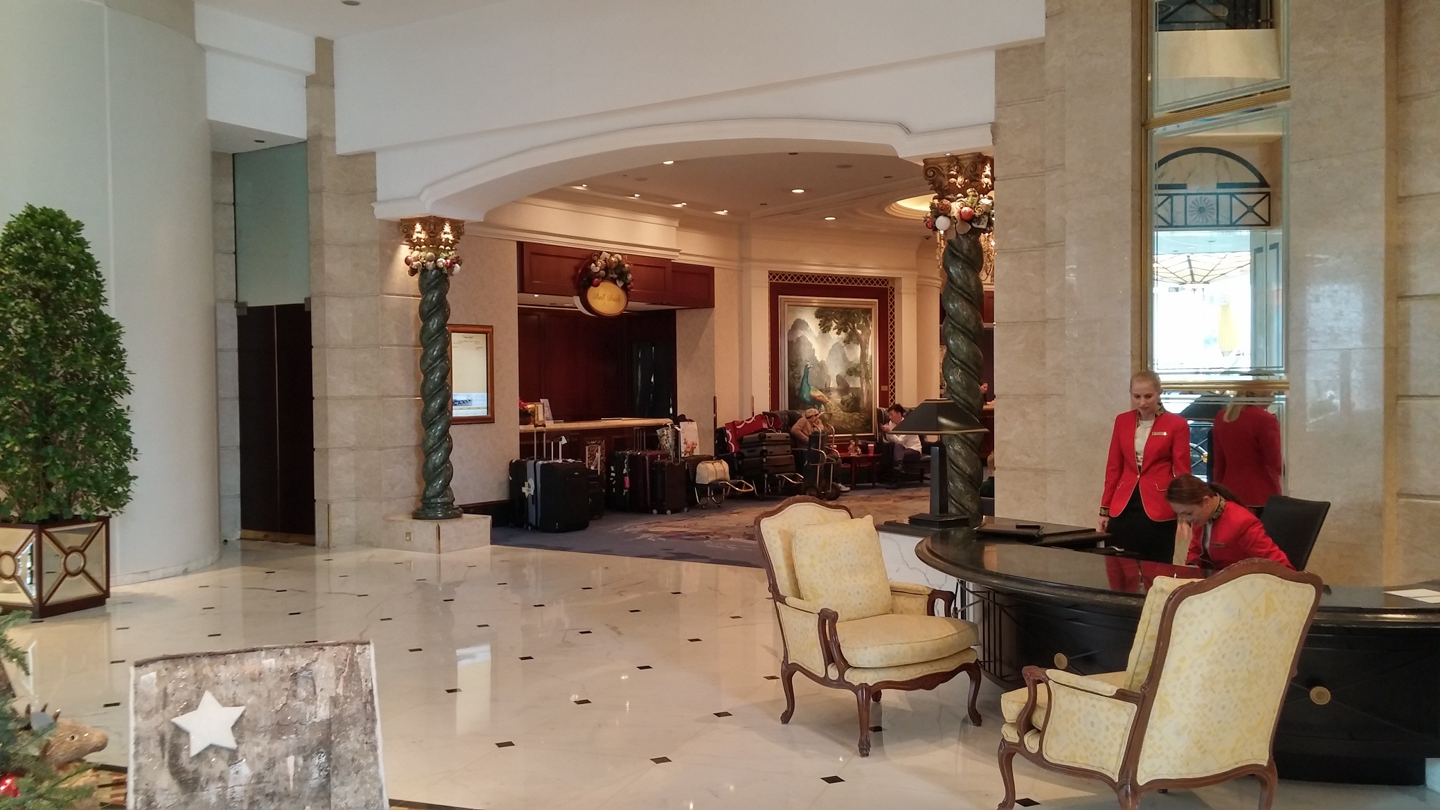 hotel lobby, sofa, female hotel concierge staff
