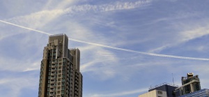 cloud, contrail, two buildings