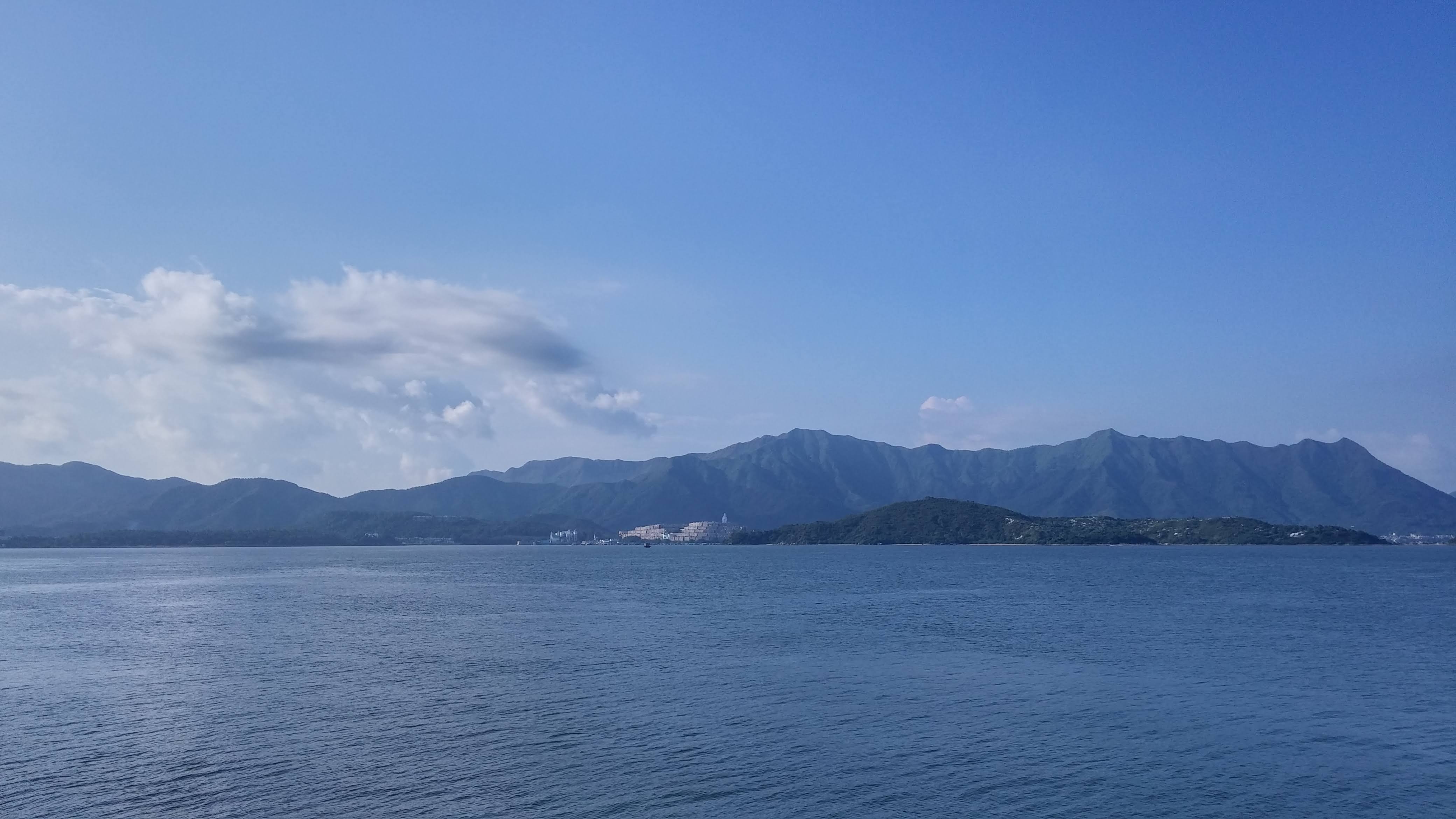 blue sky, green mountain, sea