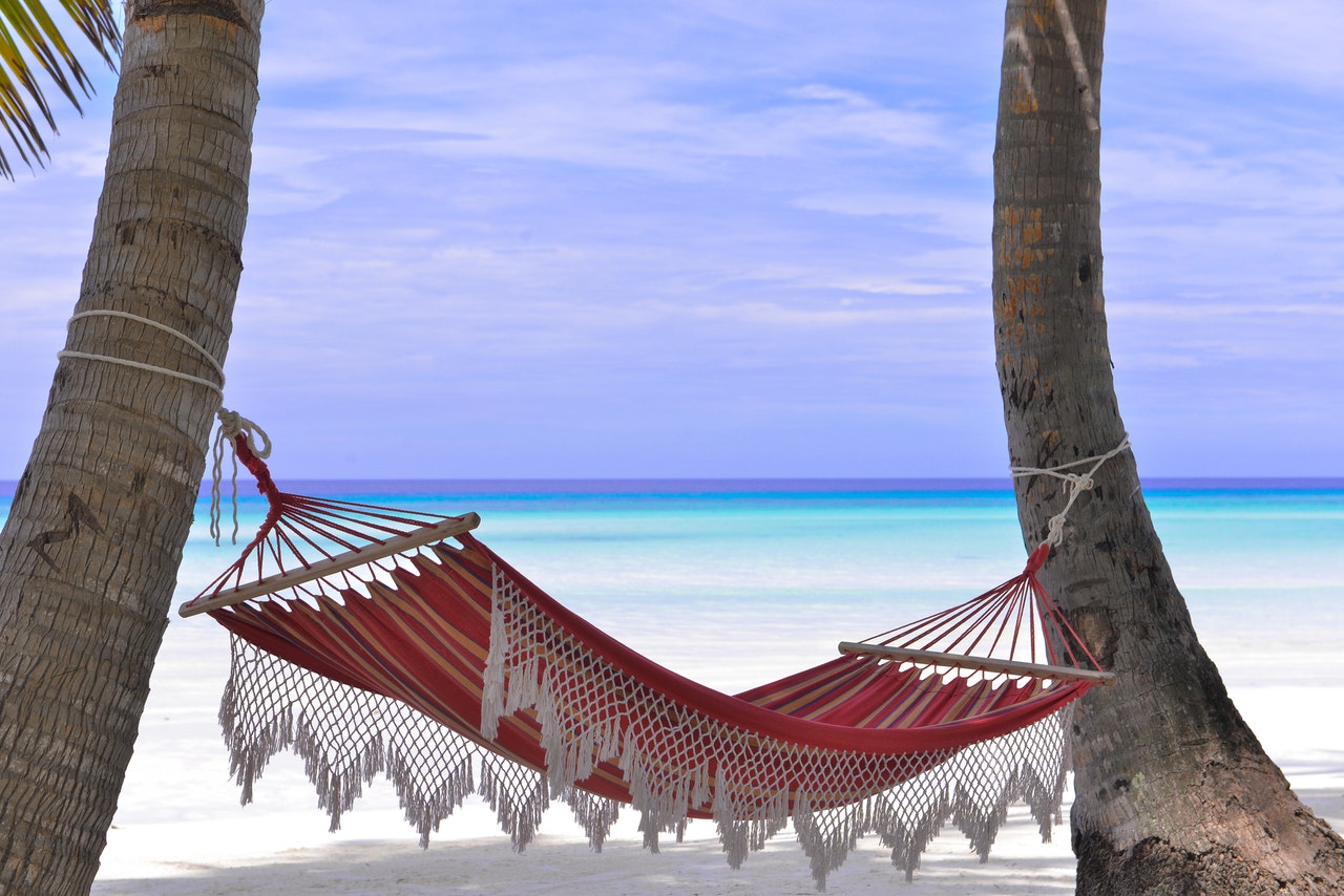 red-hammock-tied-between-two-trees