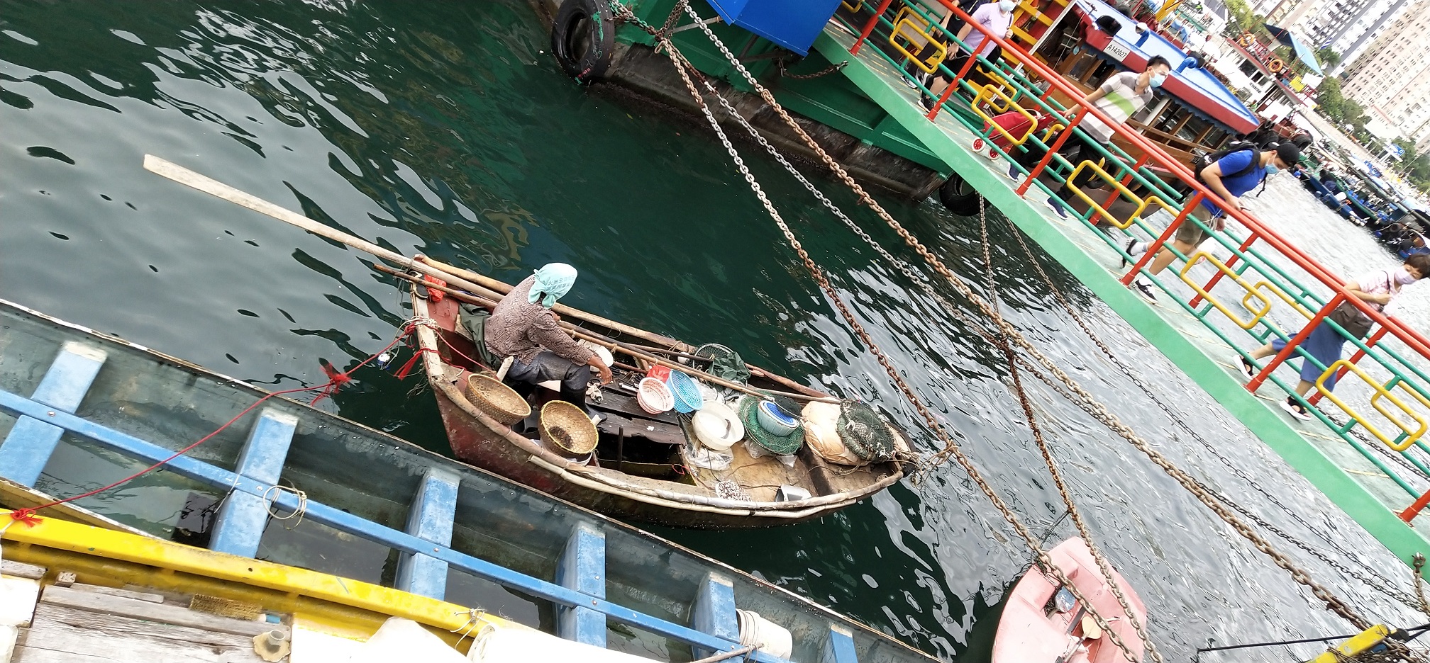 Fisherman is seeling fresh seafood to the public sampan passengers