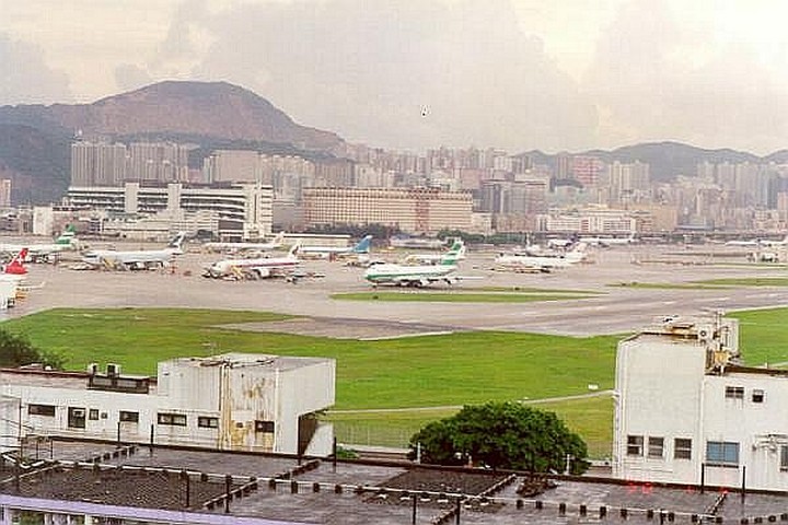 Kai Tak Airport was surrounded by buildings and hills.