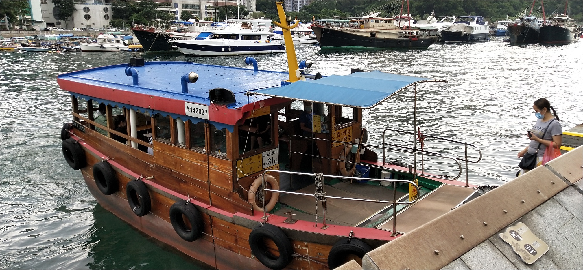 Passengers are boarding the sampan