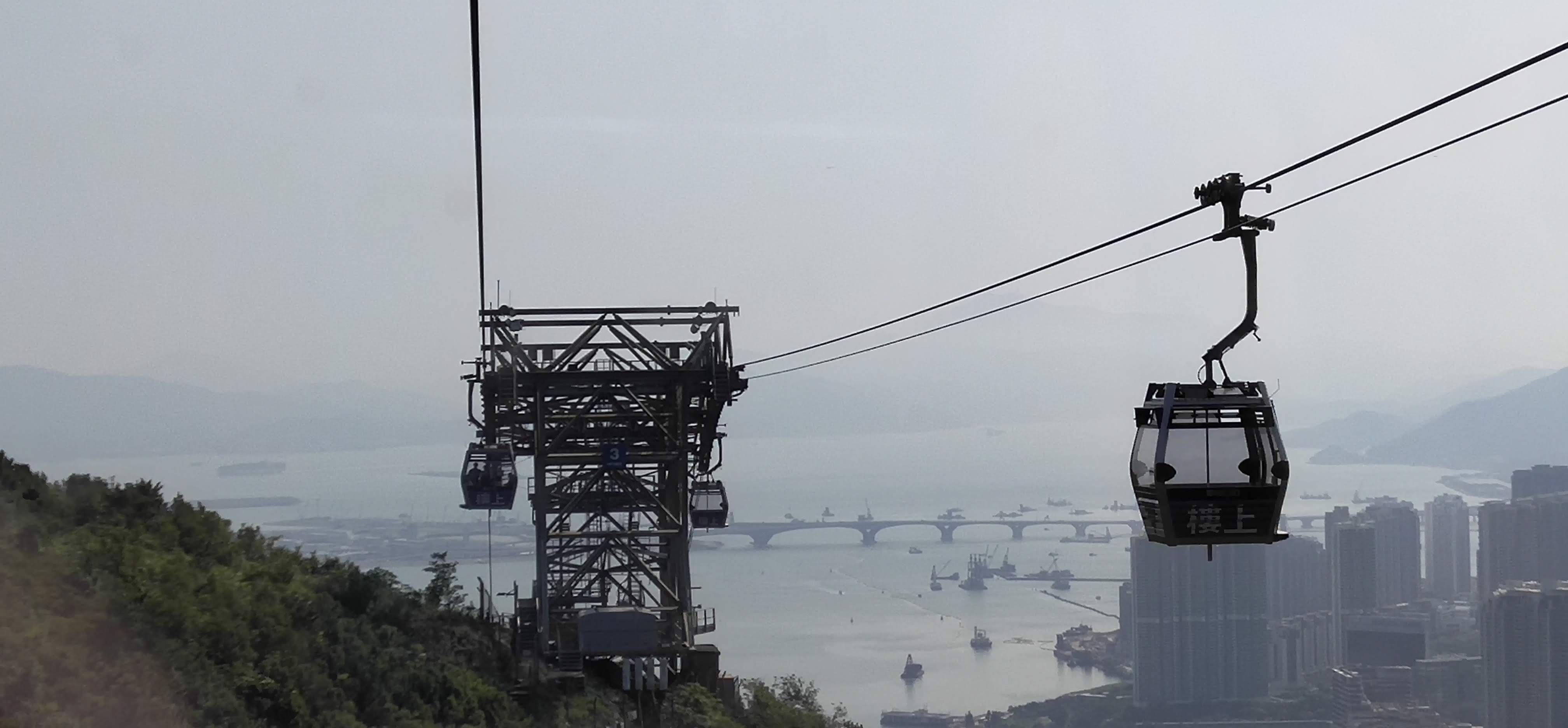 misty weather, cable car tower, cable car cabins, sea, bridge