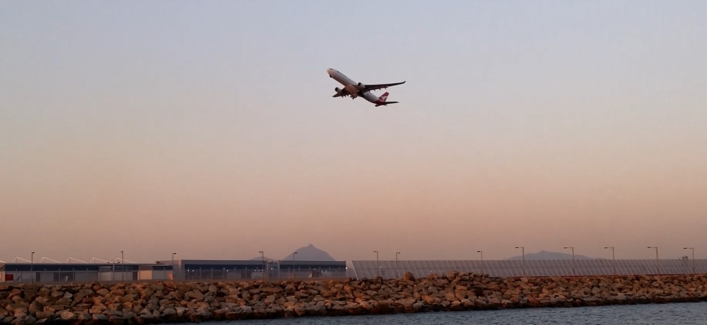 flight taking off, airport runway, causeway, sunset