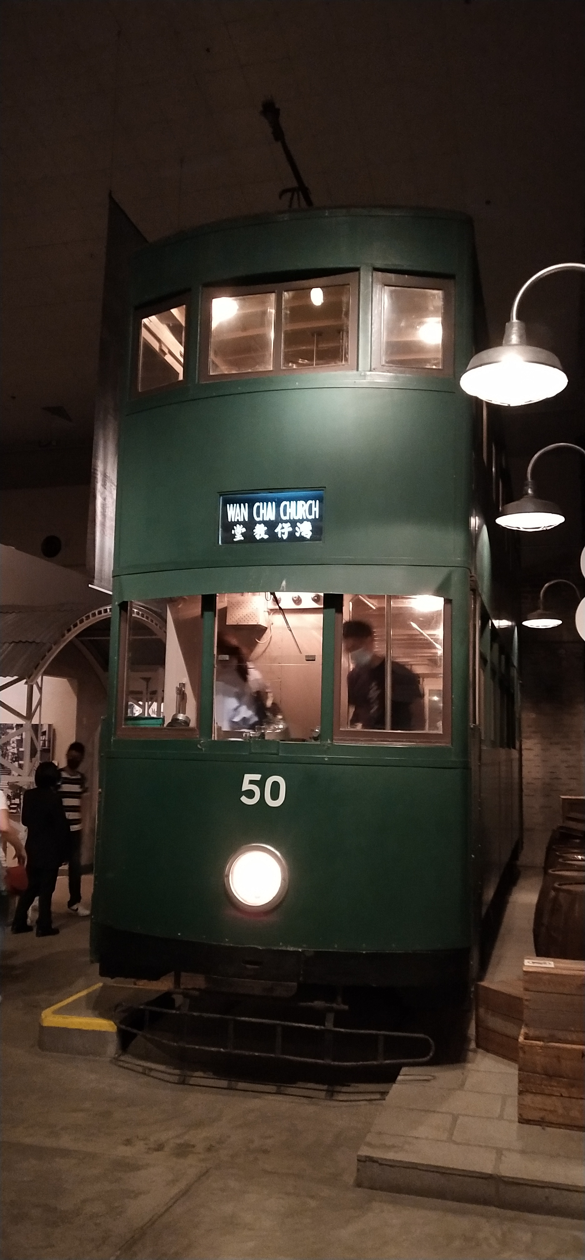 exhibit, double decker tram, dark green color
