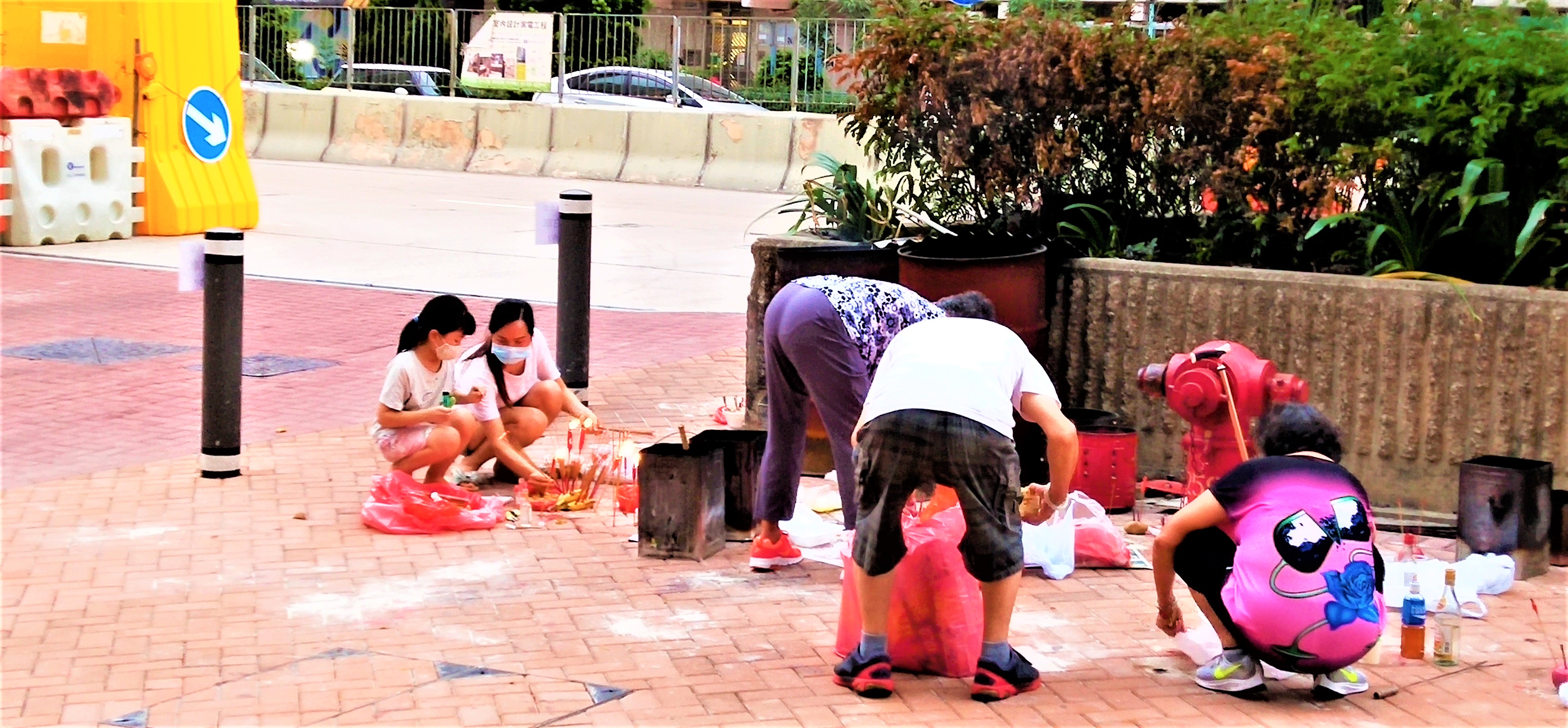People are offering paper money and food for hungry ghosts on the street