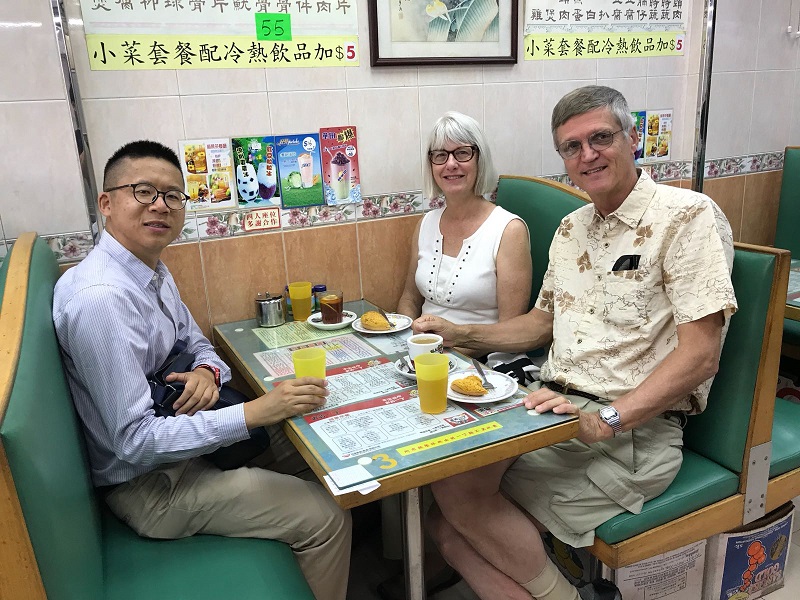 Frank and Mr. and Mrs. Wallick enjoy local afternoon tea.