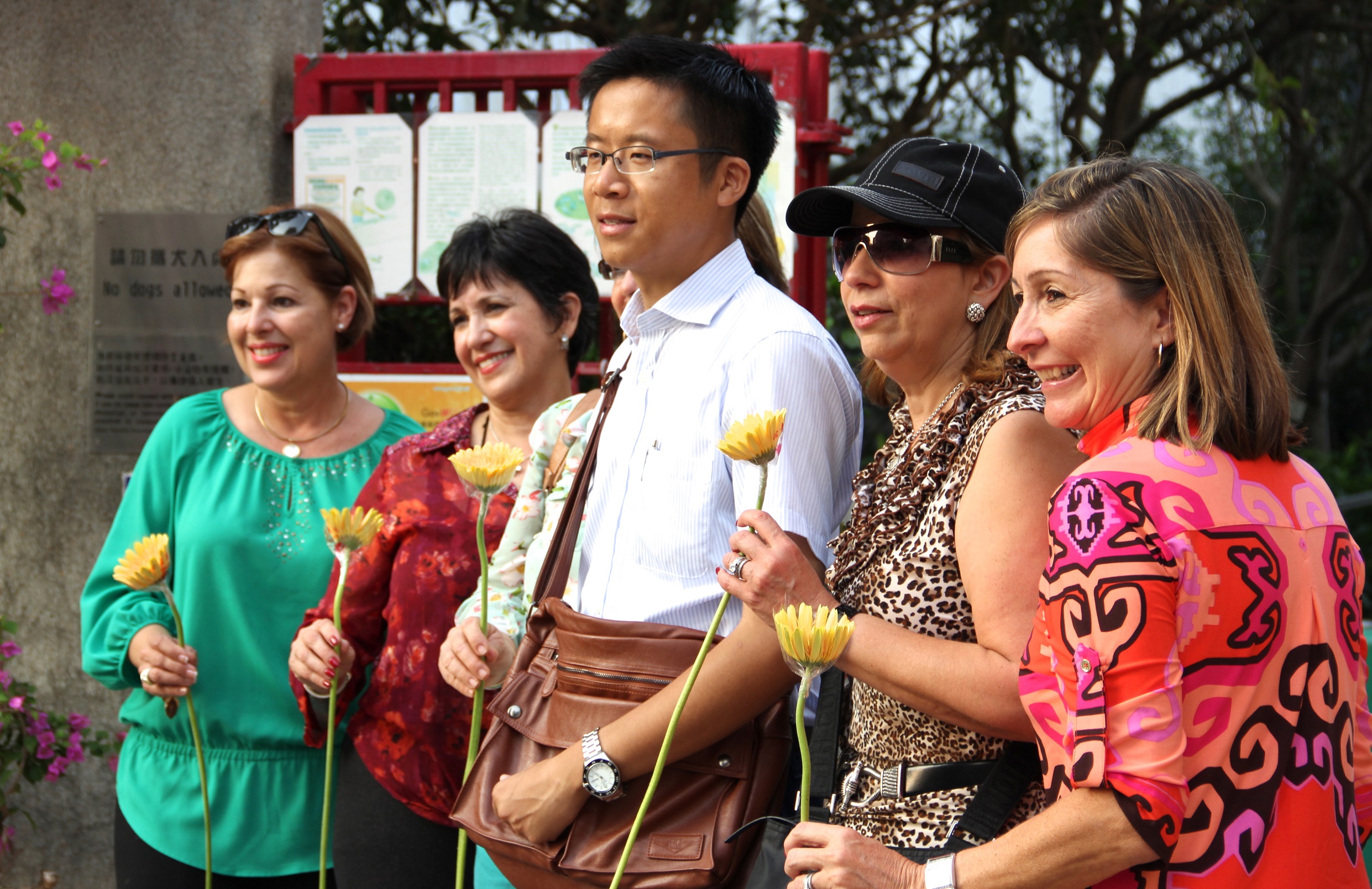 Frank takes photo with clients at Flower Market