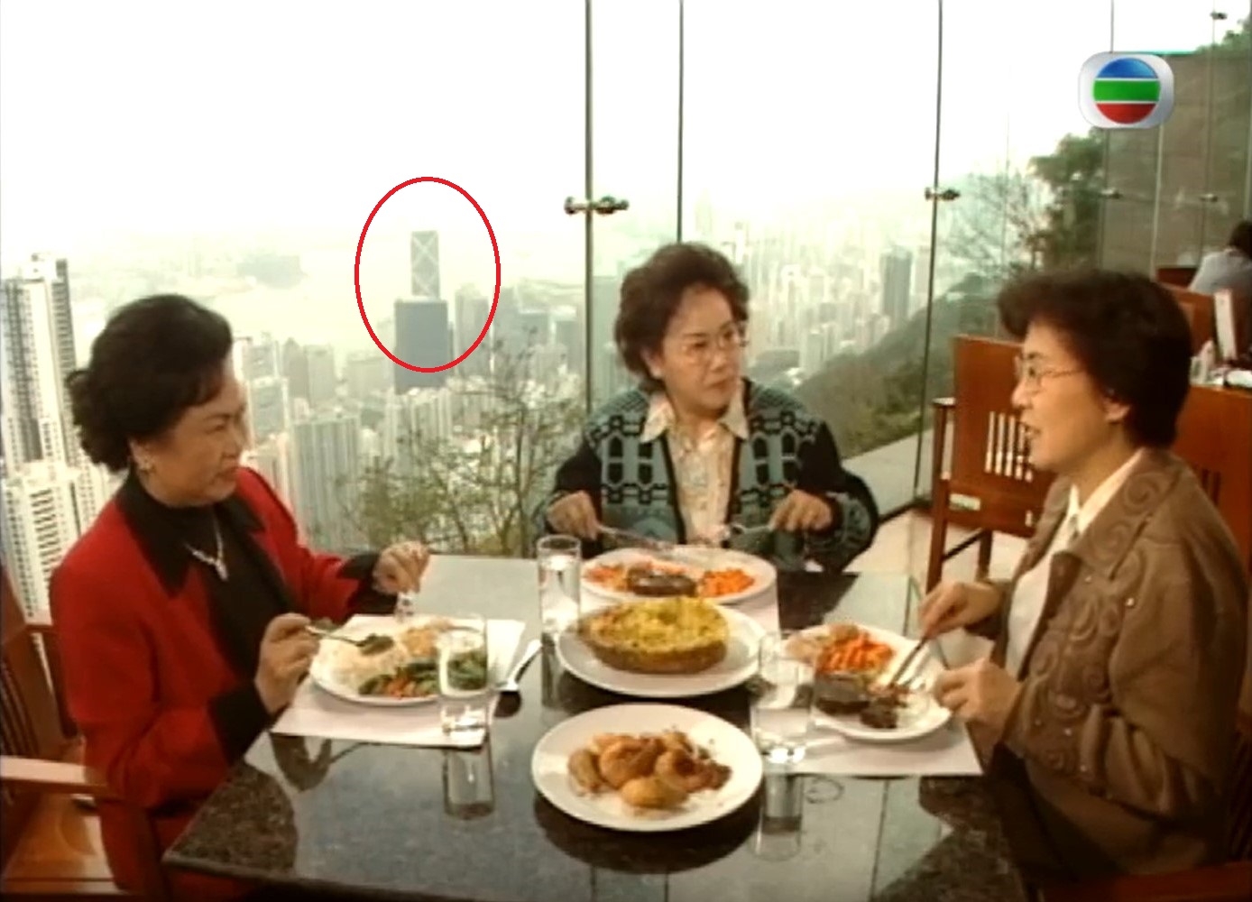 The filming location was Cafe Deco. The screenshot backdrop is Bank of China Tower.