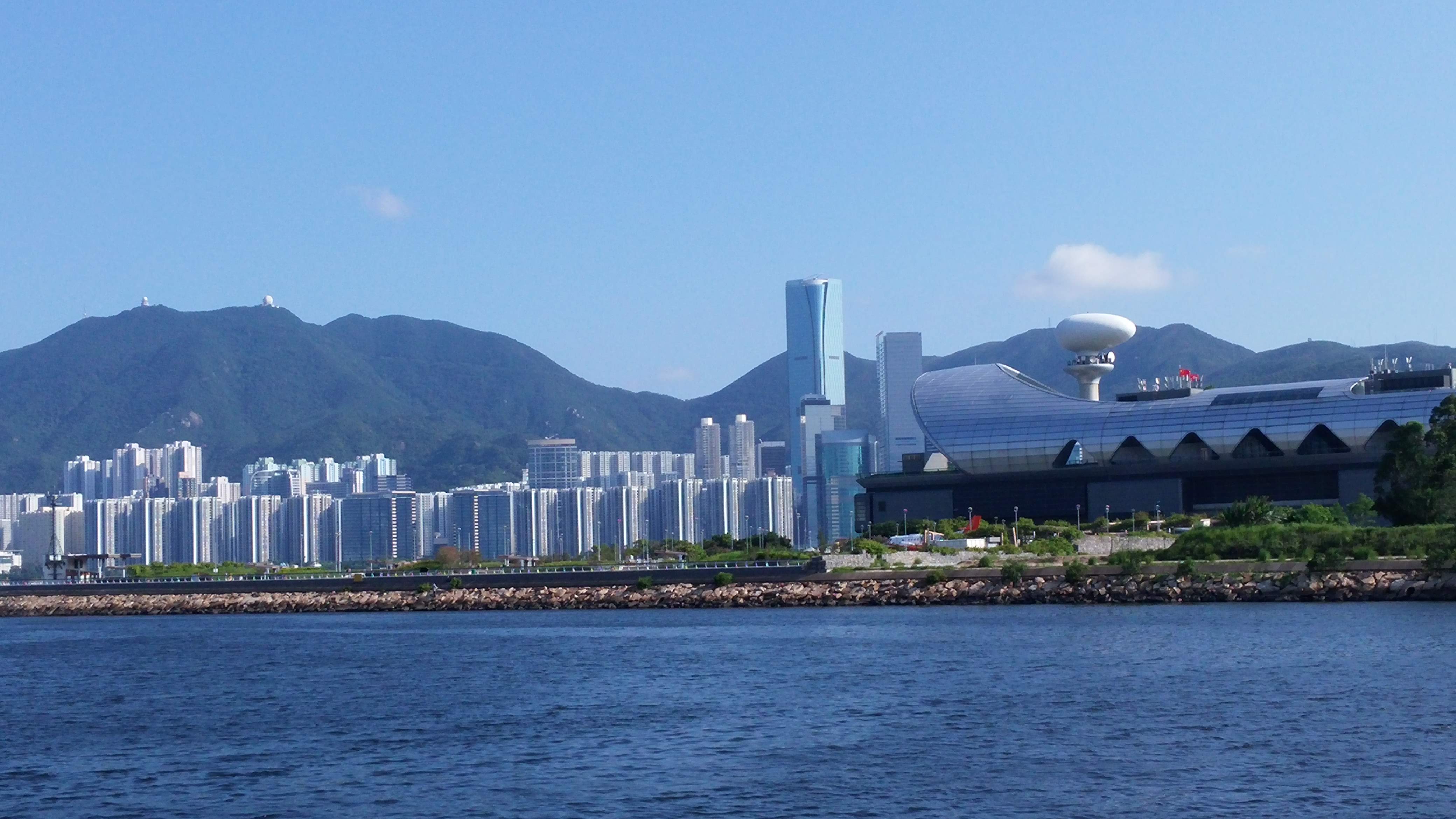 See the Kai Tak Cruise Terminal and Hong Kong Island from the Kwun Tong Promenade