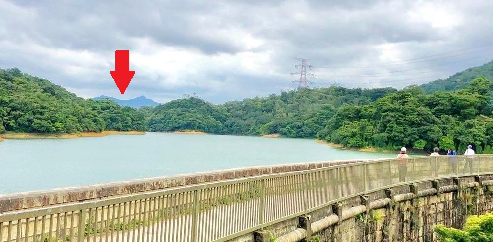 See the Ma On Shan (Saddle Hill) (red arrow) from the Main Dam of Kowloon Reservoir