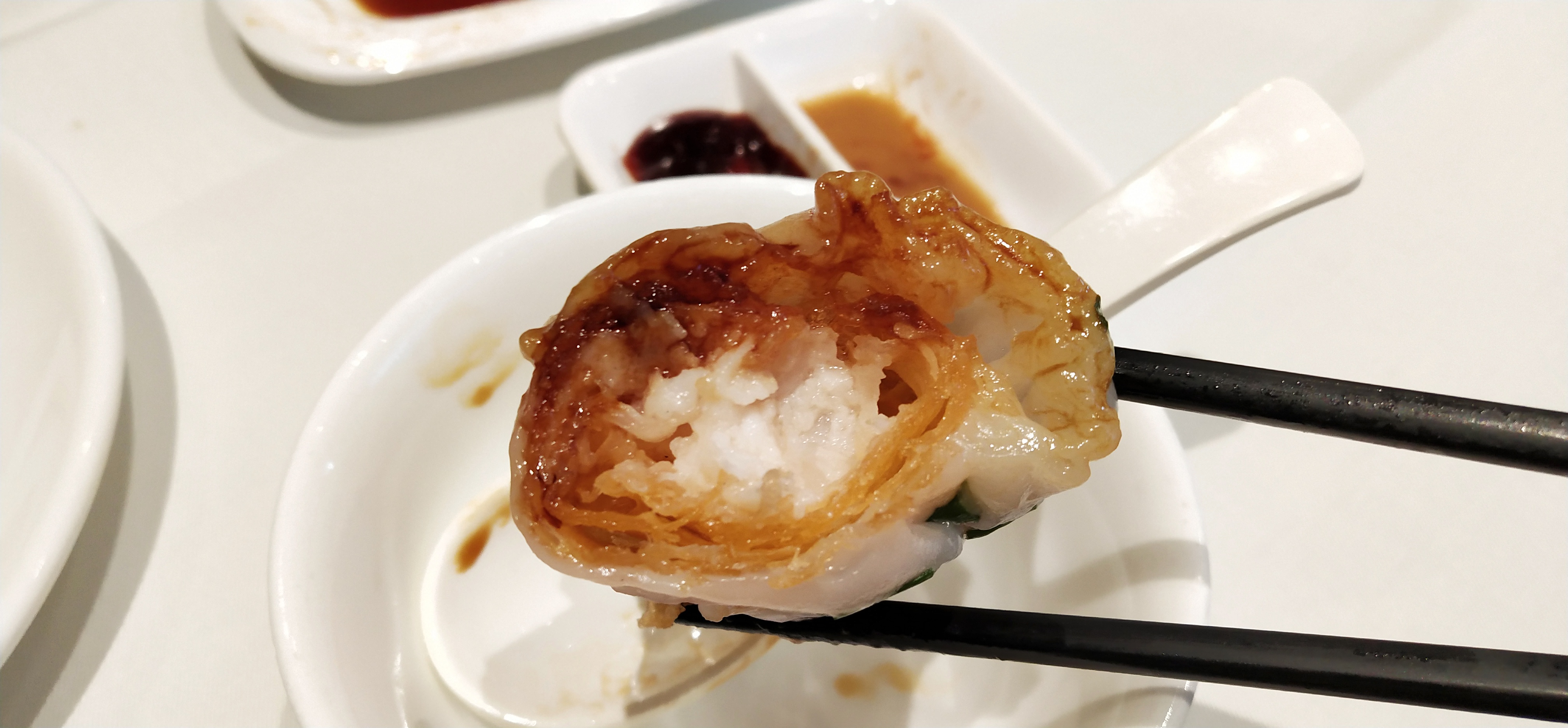 The rice roll and dough absorb the soy sauce.