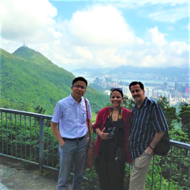 Frank and clients take photo at Kowloon Peak
