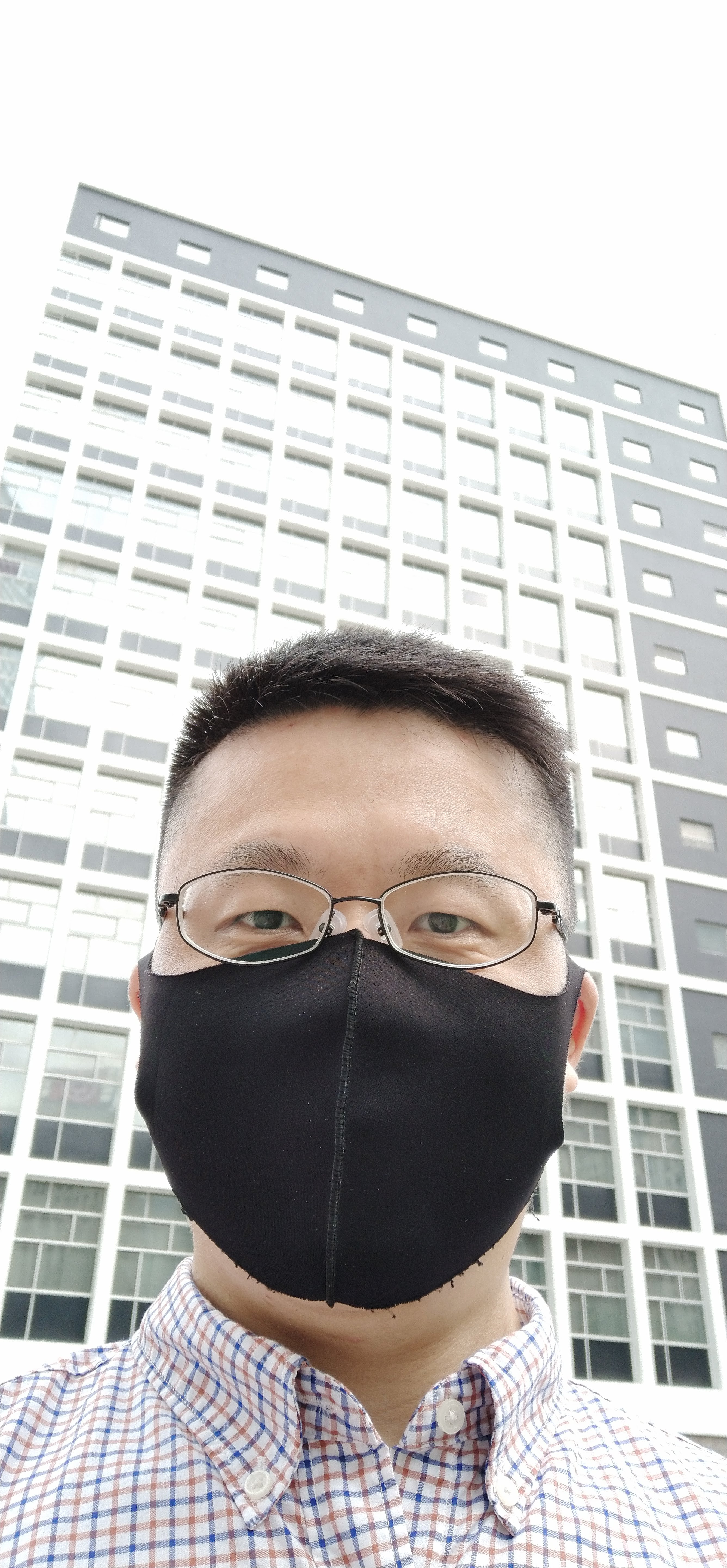 Frank the tour guide takes selfie in front of the Hong Kong City Hall