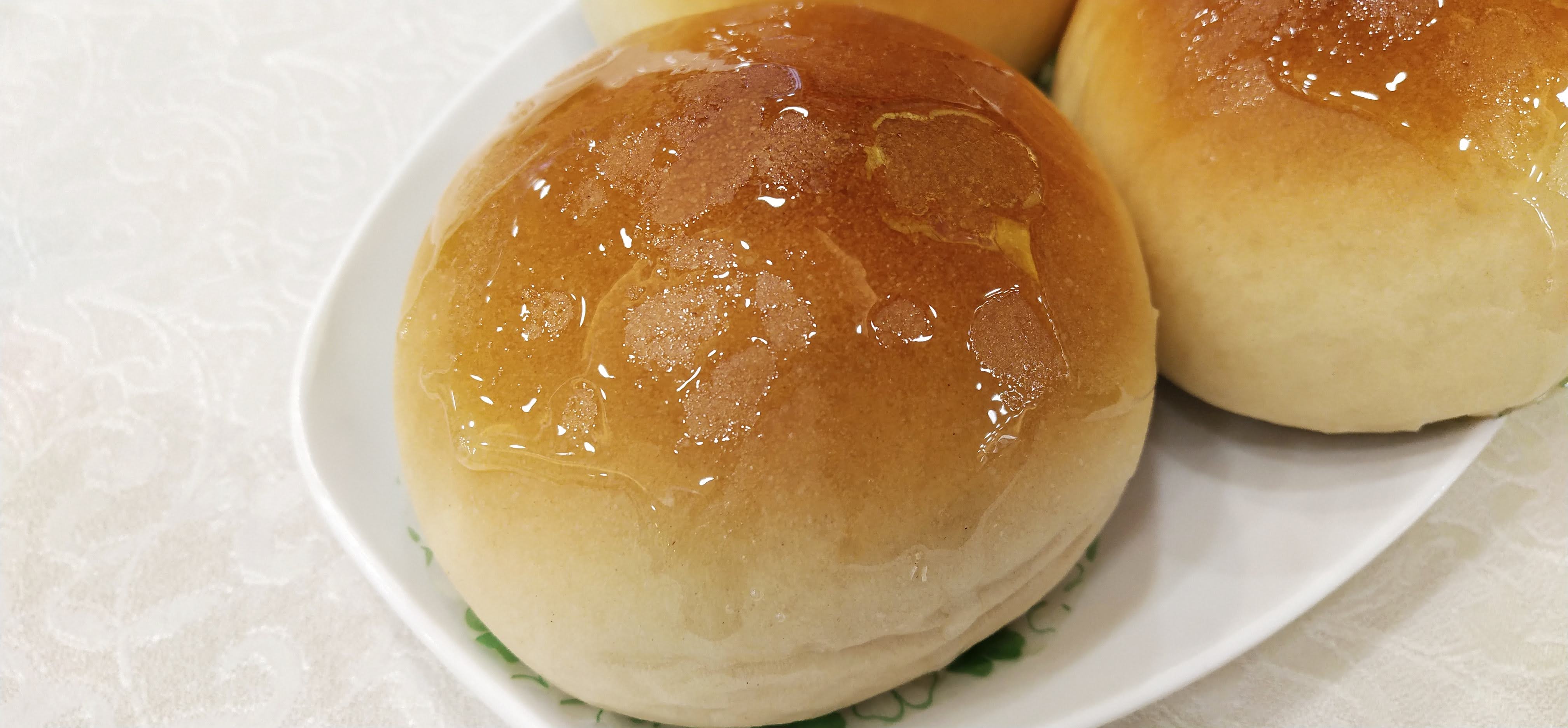 There is honey on the top of the bun