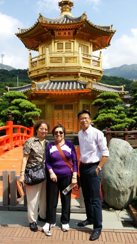 Frank the tour guide takes photo with Wallace Mom and her sister at Nan Lian Garden.