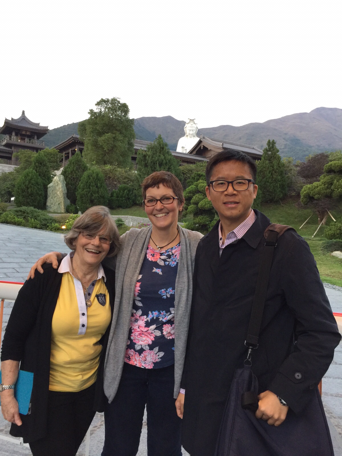 Frank the tour guide took photo with clients outside the Tsz Shan Monastery. The backdrop was the tall Goddess of Mercy Statue.
