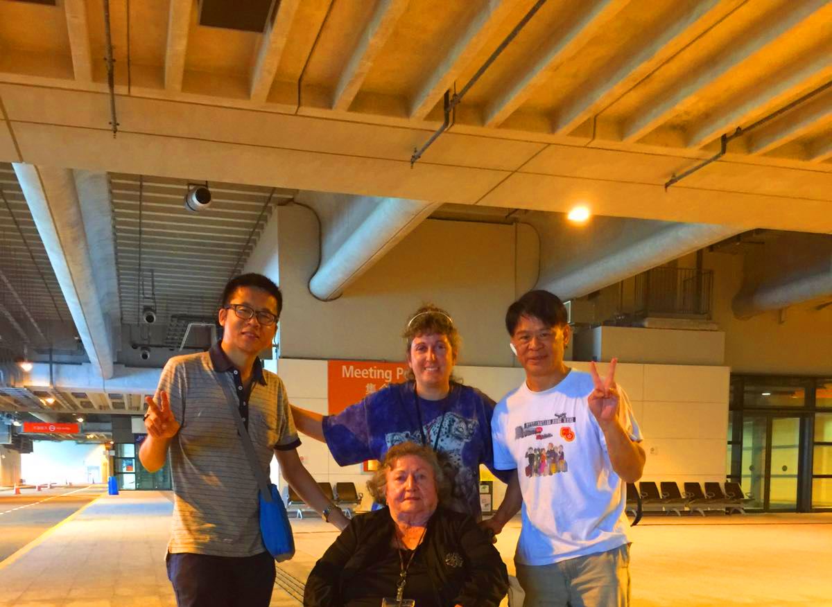 From left to right, Frank the tour guide, client Maura, Maura's mother and driver took photo at the end of the private tour by private car at Kai Tak Cruise Terminal.