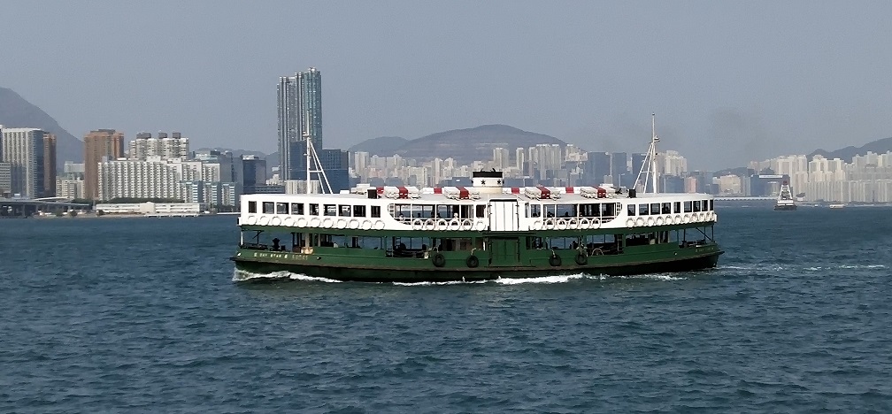 Star Ferry boat sails between Tsim Sha Tsui and Wan Chai.
