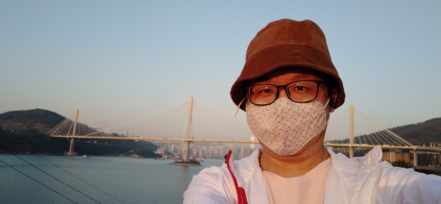 Frank the tour guide's selfie. The backdrop is Ting Kau Bridge.