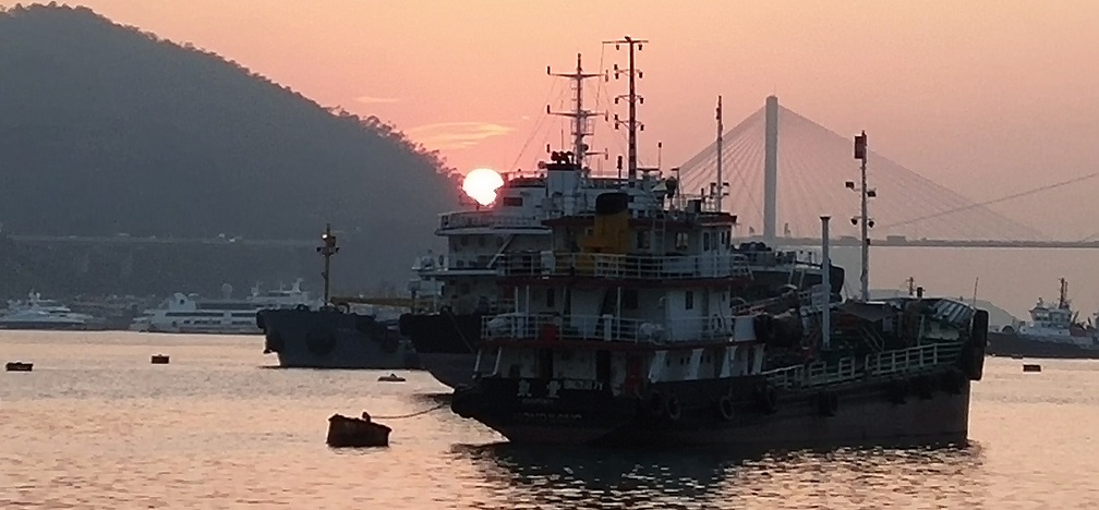 See sunset and Ting Kau Bridge at Tsuen Wan West Promenade.