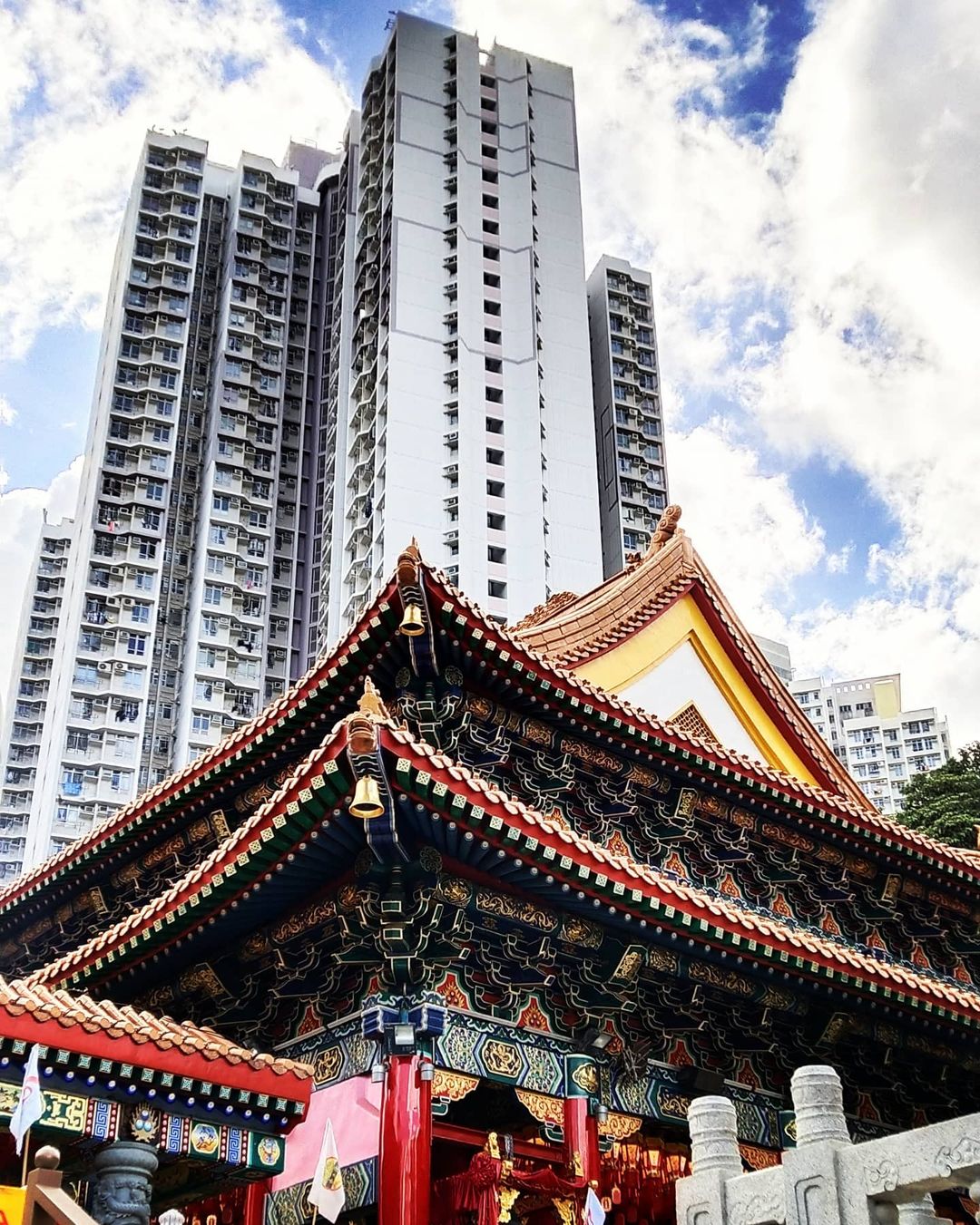 The big contrast between modern public housing and traditional Wong Tai Sin Temple.