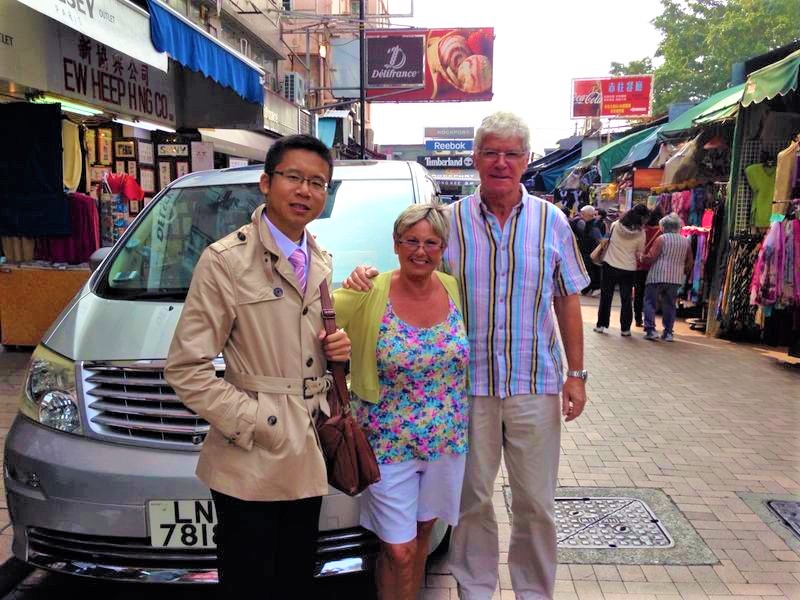 Frank the tour guide took photos with clients at Stanley