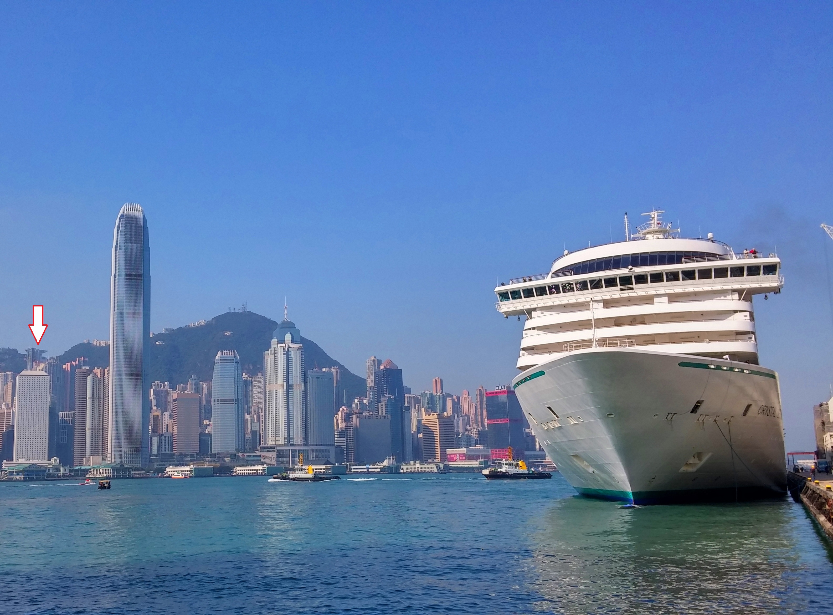 See Victoria Peak's Peak Tower (white arrow) at Ocean Terminal in Kowloon