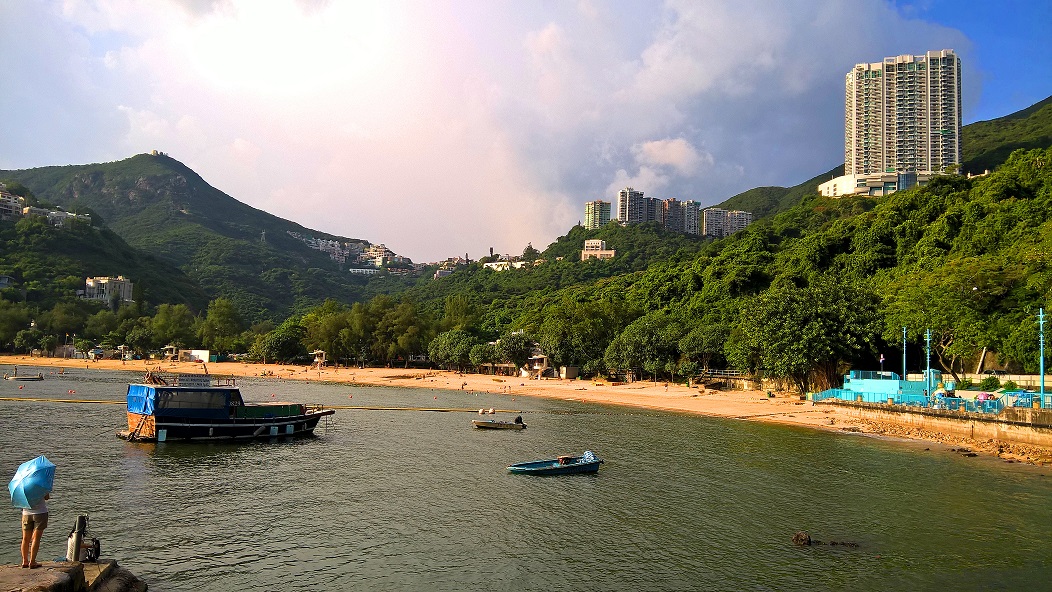 See pretty Deep Water Bay from the car on the scenic Island Road.