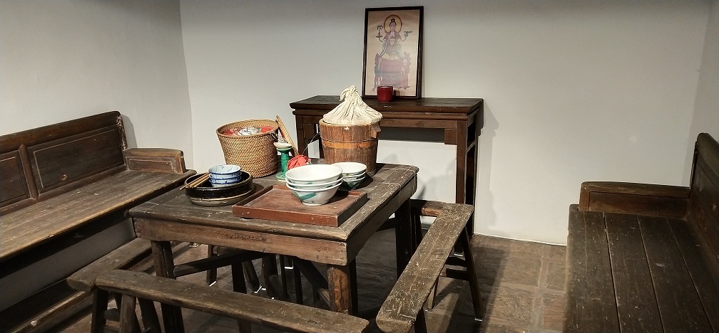 The exhibits show visitors the living room and dining room of the traditional Sam Tung Uk walled house.